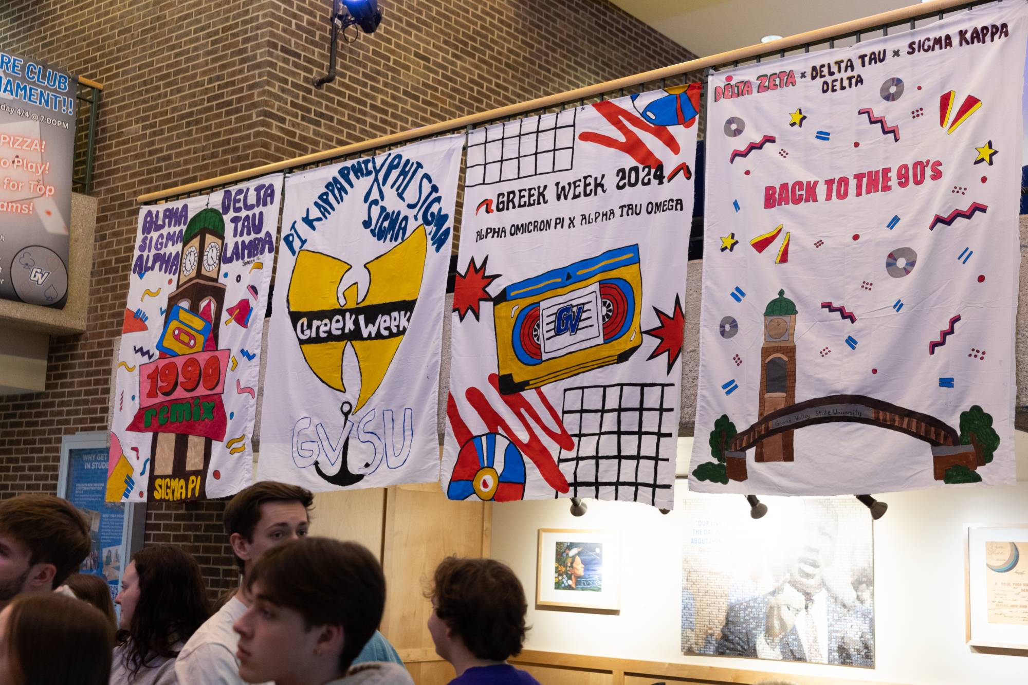 4 banners hung in Kirkhof Lobby from Greek Week 2024